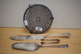 A plated teapot stand of reticulated design sold along with a fish server, cake slice and sugar