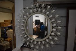 A mid century style cream framed mirror.