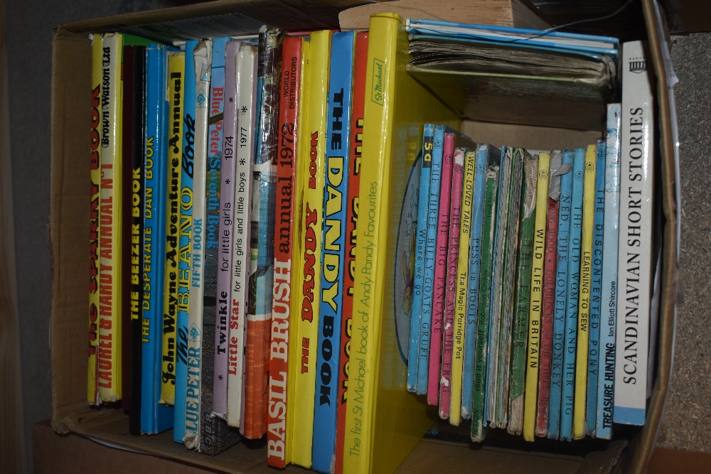 A collection of vintage children's annuals, including Blue Peter, Laurel & Hardy, The Dandy, Basil