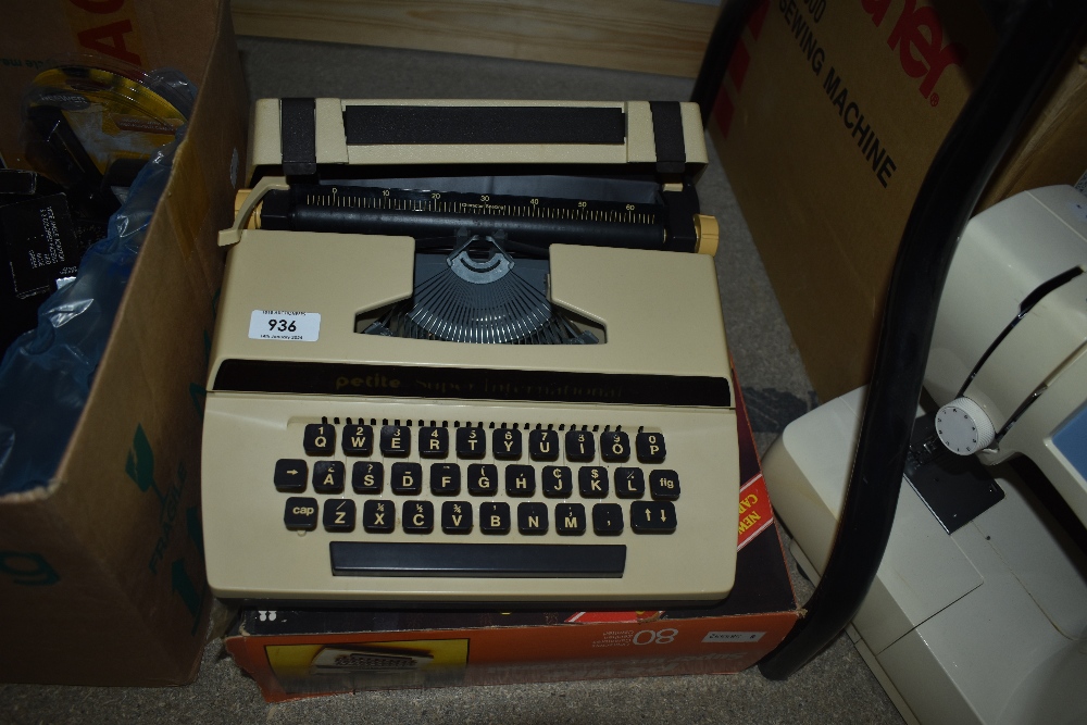 A 1970s Petite Super International typewriter with box