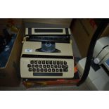 A 1970s Petite Super International typewriter with box