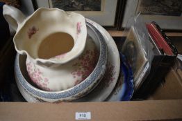 An antique wash basin and jug having floral pattern, a Victorian basin, a planter and two books, '