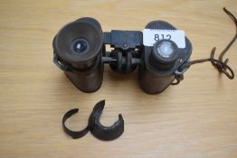 A Pair of CP Goertz 6X binoculars (damage to one eye piece) Engraved W M Mann XIX Regt