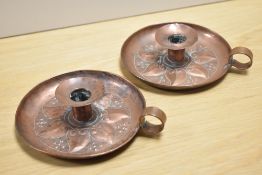 A pair of unsigned Keswick School of Industrial Art (KSIA) Arts & Crafts copper chamber sticks, with