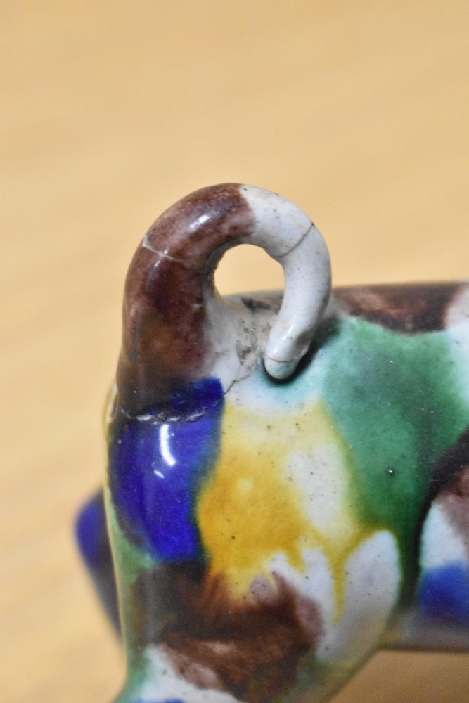 An early 20th Century spongeware glazed dog study, multi-coloured, having repairs to tail and - Image 4 of 4