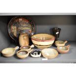 An assorted collection of studio pottery, to include an Oriental inspired plate with pagoda design