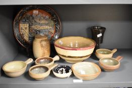 An assorted collection of studio pottery, to include an Oriental inspired plate with pagoda design