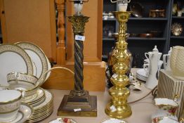 A brass Corinthian column form table lamp, with spiralled/ twisted stem and stepped bases, sold with