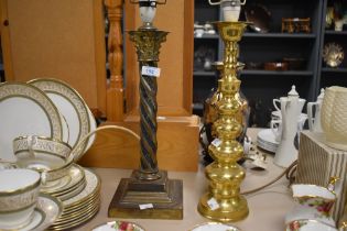 A brass Corinthian column form table lamp, with spiralled/ twisted stem and stepped bases, sold with