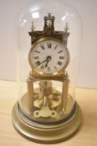 A late 19th/early 20th Century brass anniversary clock, by Gustav Becker, having an enamelled