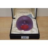 A Caithness glass paperweight in case. 'Triad' designed by Colin Terris.