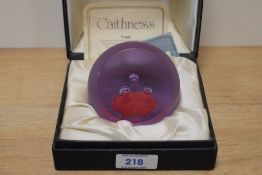 A Caithness glass paperweight in case. 'Triad' designed by Colin Terris.