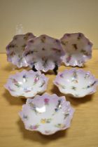 A collection of mid-20th Century Czechoslovakian floral saucers, or dessert dishes, with shaped