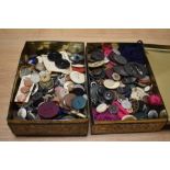 Two tins of vintage buttons and sewing accessories