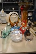 A collection of vintage art glass, including ducks and red and amber glass vases, blue bowl and