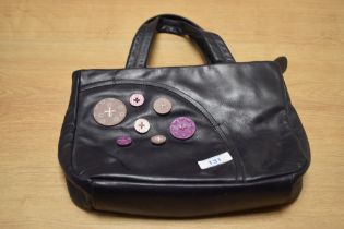 A vintage Radley leather buttons hand bag