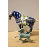 A Chinese Tang style glazed pottery horse, with faint impressed mark to base, measuring 22cm tall,