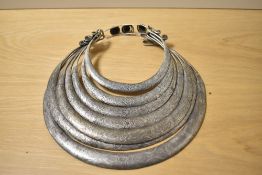 A Chinese Miao white metal tribal necklace, with engraved decoration, measuring 29cm long