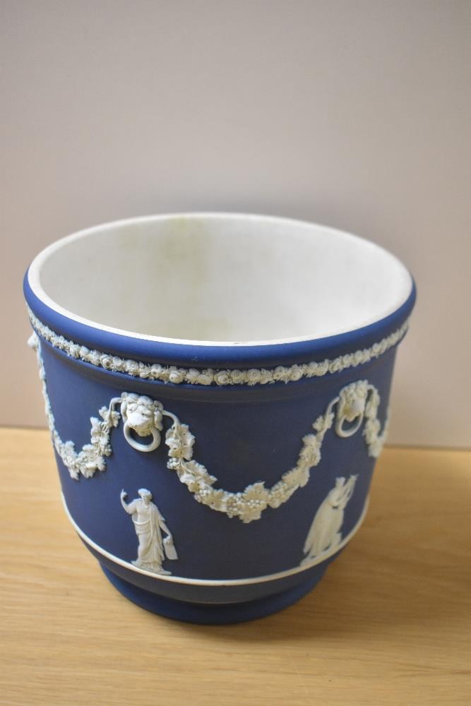 A 19th Century Wedgwood blue Jasperware jardiniere, measuring 20cm tall, sprigged with classical