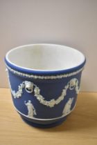 A 19th Century Wedgwood blue Jasperware jardiniere, measuring 20cm tall, sprigged with classical