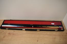 A BCE Sports pool cue in case.