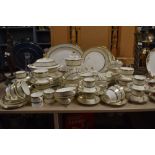 A collection of Minton 'Aragon' dinner service, including tureen, cups and saucers, platters, soup