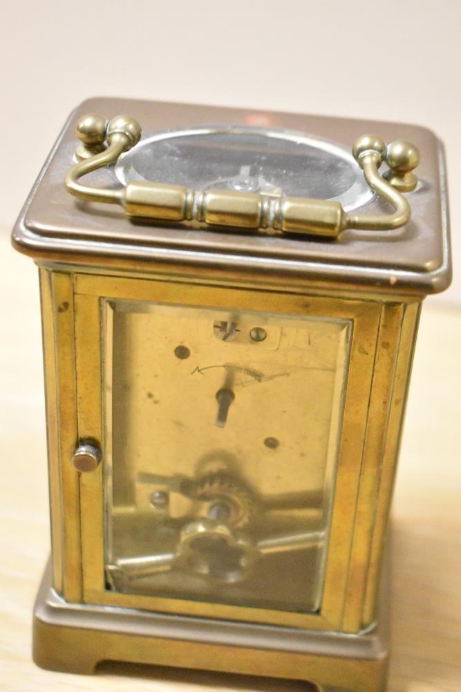 A 19th Century brass cased carriage clock, with enamelled Roman dial, measuring 12cm tall - Image 2 of 4