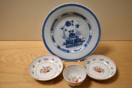 A 19th Century Delft glazed plate, possibly English, diameter 23cm, two Newhall porcelain saucers,