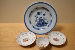 A 19th Century Delft glazed plate, possibly English, diameter 23cm, two Newhall porcelain saucers,
