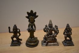 A group of Indian brass votive ornaments, of deities, including an 18th Century Indian study of