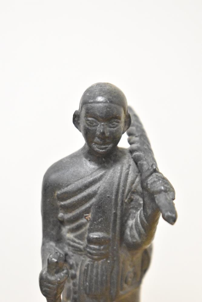 Two antique cast metal Buddha ornaments, to include one of a Sivali Buddhist monk, the largest - Image 2 of 5
