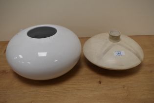 A modern ceramic planter or vase of bulbous form and a similar stylised example.