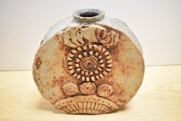 A mid-20th Century Troika style wheel vase, of brutalist design, measuring 26cm tall, showing some