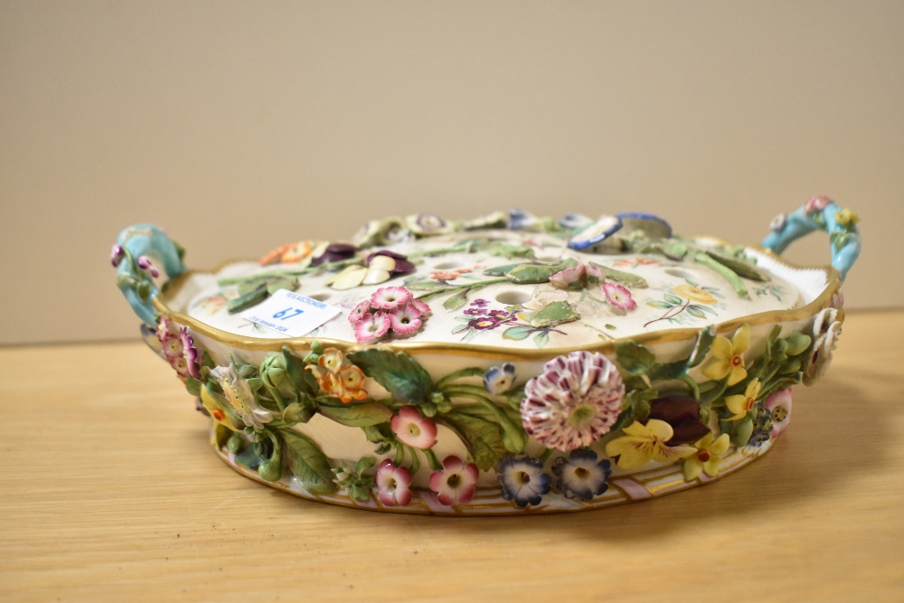 A Regency Period Minton style porcelain pot pourri dish and cover, decorated with intricately