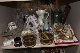 A selection of vintage items, including cut glass vase, ceramic clock with floral decoration,