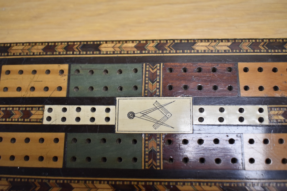 A Victorian Masonic cribbage board, marquetry inlaid and with bone panels, measuring 32cm long - Image 2 of 4