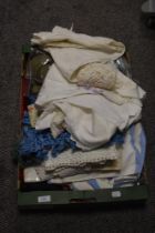 A selection of vintage table linen, blouses, tights and similar.