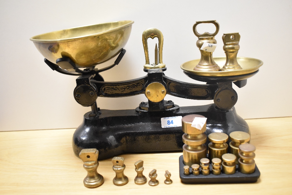 A set of 19th/20th Century cast iron kitchen scales, finished in black, with a selection of - Image 2 of 2