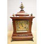 A late Victorian mahogany bracket style clock, the case having decorative gilt mounts and