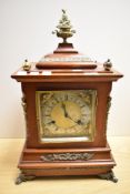 A late Victorian mahogany bracket style clock, the case having decorative gilt mounts and