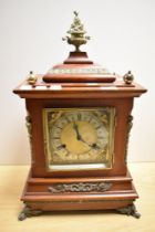 A late Victorian mahogany bracket style clock, the case having decorative gilt mounts and