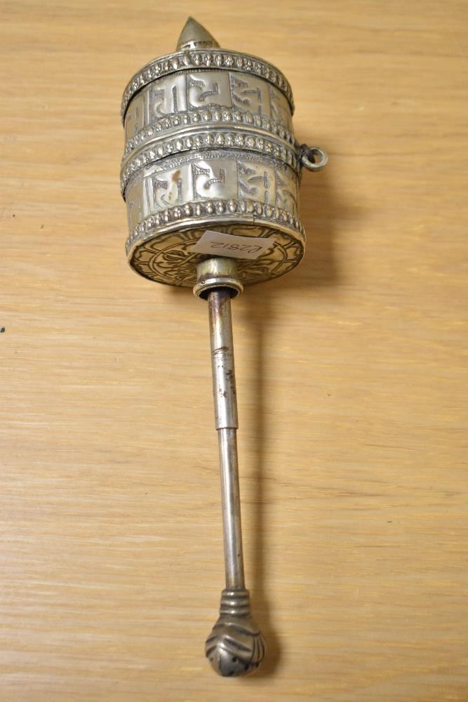 An antique white metal Tibetan prayer wheel, measuring 20cm, with engraved design - Image 3 of 3