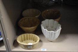 Six vintage stoneware jelly and pie moulds.