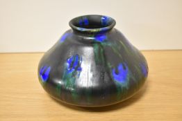 A Minton Hollins & Co Astra Ware pottery vase, c.1920s, in a mottled dripped glaze, and measuring