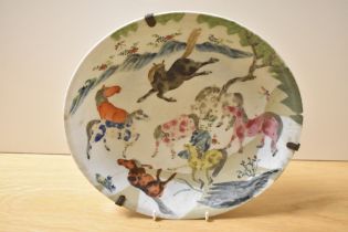 A late 19th/early 20th Century Chinese Famille Rose charger, decorated with a depiction of the 8