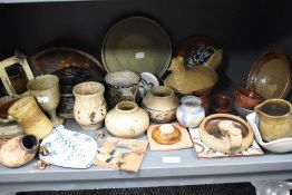 An assorted collection of studio pottery, including vases, beaker, goblet, lidded tureen, novelty