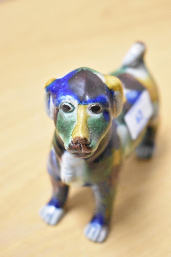 An early 20th Century spongeware glazed dog study, multi-coloured, having repairs to tail and - Image 2 of 4