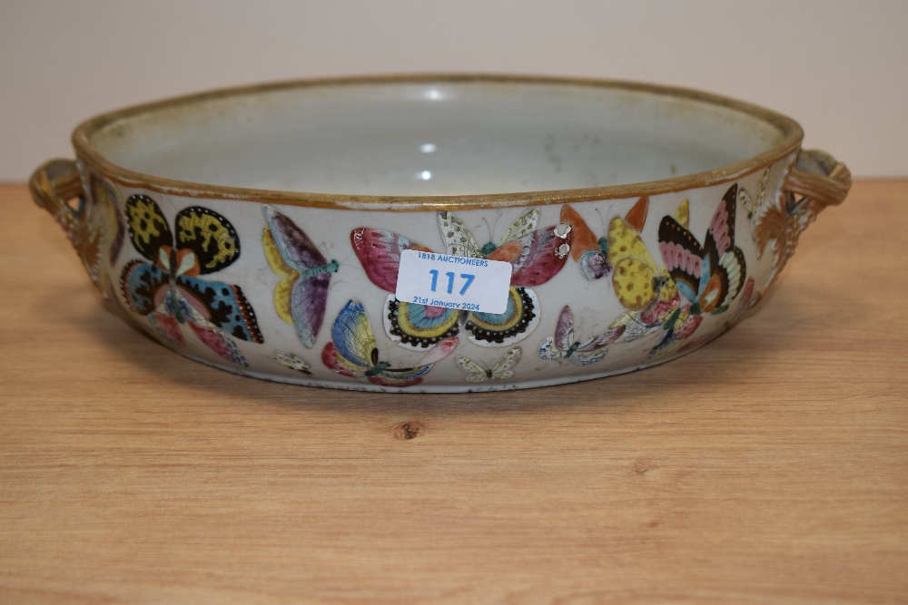 A 19th/20th Century Chinese porcelain oval dish, decorated in polychrome with butterflies, measuring