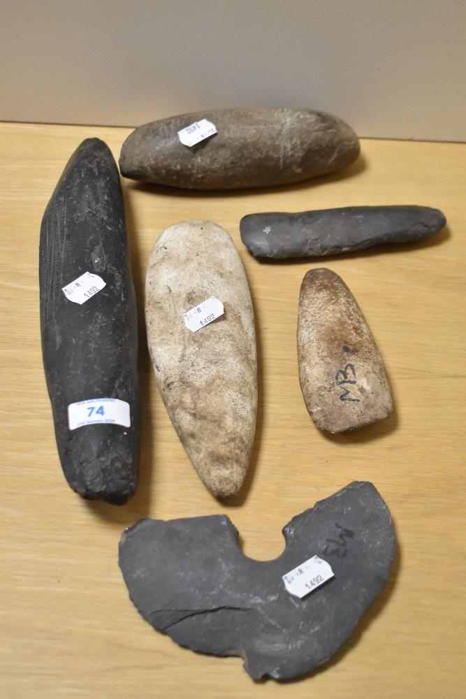 A group of interesting Oceanic axe heads and cooking implements, of Papua New Guinea origin, to