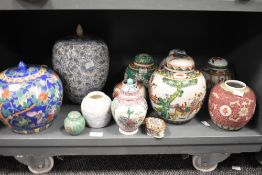 An assorted group of 19th/20th Century Chinese polychrome ginger jars and vases, some with covers,